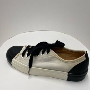 The office of Angela Scott black and white sneaker size 7